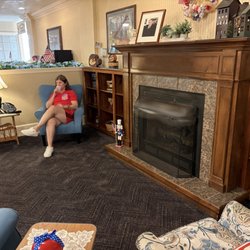 1863 Inn Of Gettysburg - The living room at the Inn. Behind the occupied blue chair are tables and chairs where you can enjoy coffee, tea or hot chocolate.
