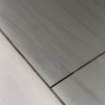 Michigan Building Specialties - Tile coming up in master bathroom - General Contractors Near Me - Adrian, Michigan