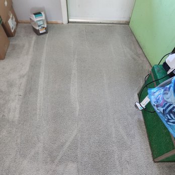 White Mountain Chem-Dry - Entryway at the door with the shampooer waste bin showing how dirty it was after WMCD supposedly cleaned. - Carpet Cleaning Near Me - Rock Springs, Wyoming White Mountain Chem-Dry - Entryway at the door with the shampooer waste bin showing how dirty it was after WMCD supposedly cleaned. - Carpet Cleaning Near Me - Rock Springs, Wyoming