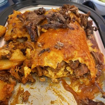 Adovada breakfast burrito smothered in red sauce w/ brisket