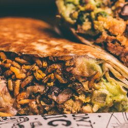 tacoria - Cherry Hill - Tacoria's signature grilled burrito is packed with your choice of protein, seasoned rice, black beans, guacamole, melted chee...