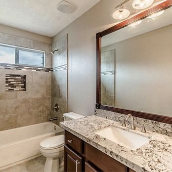 Westlake Homes - a bathroom with a marble counter top - General Contractors Near Me - Houston, Texas Westlake Homes - a bathroom with a marble counter top - General Contractors Near Me - Houston, Texas