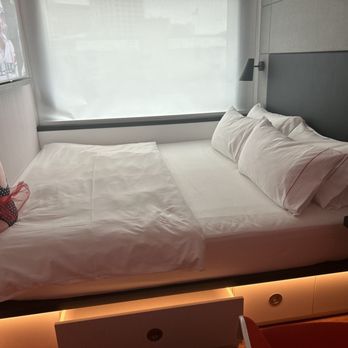 citizenM Seattle Pioneer Square - King-size bed with city side view - Hotels Near Me - Seattle, Washington