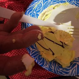 a person cutting a piece of cake a person cutting a piece of cake