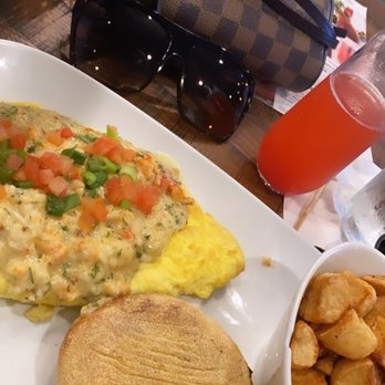 Another Broken Egg Cafe - lobster and brie omelette and the strawberry st. germain mimosa - Breakfast & Brunch Near Me - Winter Park, Florida Another Broken Egg Cafe - lobster and brie omelette and the strawberry st. germain mimosa - Breakfast & Brunch Near Me - Winter Park, Florida