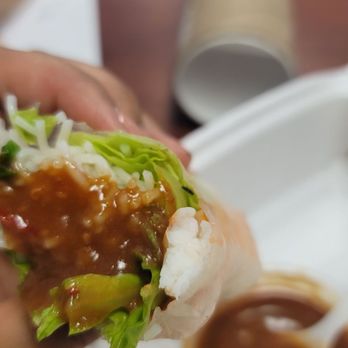 SK Noodle - a person holding a piece of food - Chinese Near Me - Sparks, Nevada SK Noodle - a person holding a piece of food - Chinese Near Me - Sparks, Nevada