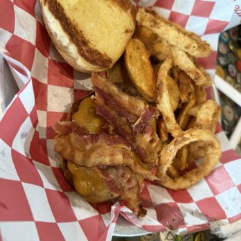 Fuddruckers - 1/2 lb bacon Chz burger $13 PLUS extra $7.50 to add "Frings" (fries & onion rings) and a soda (make it a combo).  Dry patty. - American Near Me - Norfolk, Virginia