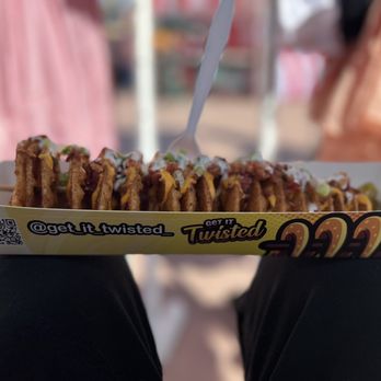 Get It Twisted - a person holding a box of food - Fast Food Near Me