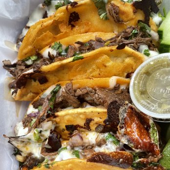 Mil Sabores - a plate of tacos and cucumbers - Food Trucks Near Me - Bridgeport, Connecticut Mil Sabores - a plate of tacos and cucumbers - Food Trucks Near Me - Bridgeport, Connecticut