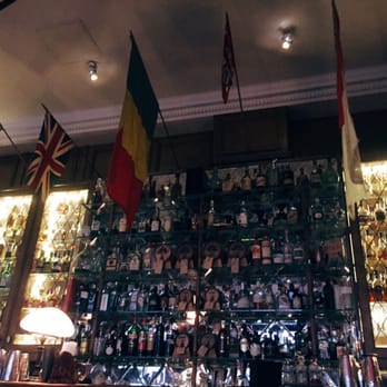 Mr Fogg's - The bar is well-decorated with flags of the world! - Cocktail Bars Near Me - Mayfair, XGL Mr Fogg's - The bar is well-decorated with flags of the world! - Cocktail Bars Near Me - Mayfair, XGL