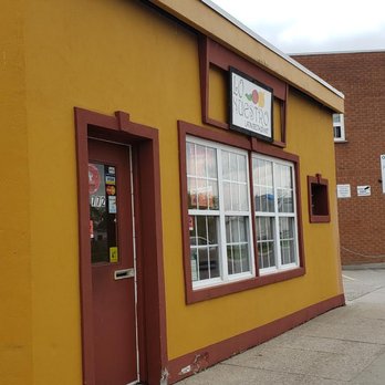 Lo Nuestro - a yellow building with a red door - Latin American Near Me - London, Ontario Lo Nuestro - a yellow building with a red door - Latin American Near Me - London, Ontario