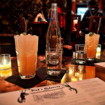 Dick's Hideaway - a table with drinks and menus - Breakfast & Brunch Near Me - Phoenix, Arizona