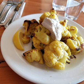 Hearth Artisan Pizza - Roasted cauliflower. It's on a bed of pesto sauce. Hefty serving. - Pizza Near Me - Anchorage, Alaska