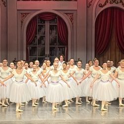 Omaha Academy of Ballet - Older dancers on stage in costume during the bows of our Spring 2026 showcase.