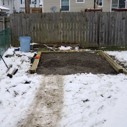 Buffalo Landscape Design - Crushed stone shed pad install - raised the area up with stone, outlined in 6x6 pressure treated timbers to keep new shed high and dry.