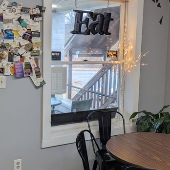 Litchfield Catering - a table and chairs in front of a window - Delis Near Me - Bantam, Connecticut