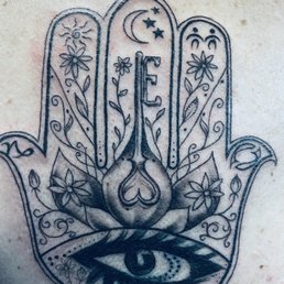 Gilda touched up an old tattoo with this hamsa.