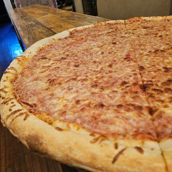 Benny Marconi's - Close-up of the 28" pizza pie with cheese. - Italian Near Me - Roanoke, Virginia Benny Marconi's - Close-up of the 28" pizza pie with cheese. - Italian Near Me - Roanoke, Virginia