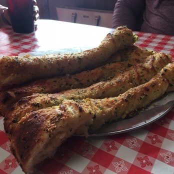 Gianni's Pizza - Garlic bread is massive!!! That's a full size plate! - Italian Near Me - Monterey, California