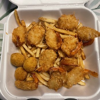Shrimp N Stuff Downtown - Coconut shrimp and french fries and hush puppies - Seafood Near Me - Galveston, Texas Shrimp N Stuff Downtown - Coconut shrimp and french fries and hush puppies - Seafood Near Me - Galveston, Texas