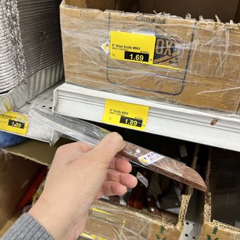 A Dong Supermarket - a person holding a pair of scissors - International Grocery Near Me - Westminster, California