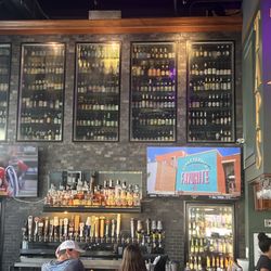 Paddy Wagon Irish Pub Downtown Tampa - Draft wall, beer cooler and TVs