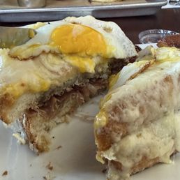 Inside the croque marone, beef, caramalized onions, gruyere cheese, on toast with an egg. Inside the croque marone, beef, caramalized onions, gruyere cheese, on toast with an egg.