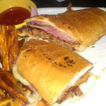 Blend - Cubano Sandwhich, Roasted pork, ham, Swiss cheese and pickles. Served with choice of side - Latin American Near Me - Long Island City, New York Blend - Cubano Sandwhich, Roasted pork, ham, Swiss cheese and pickles. Served with choice of side - Latin American Near Me - Long Island City, New York