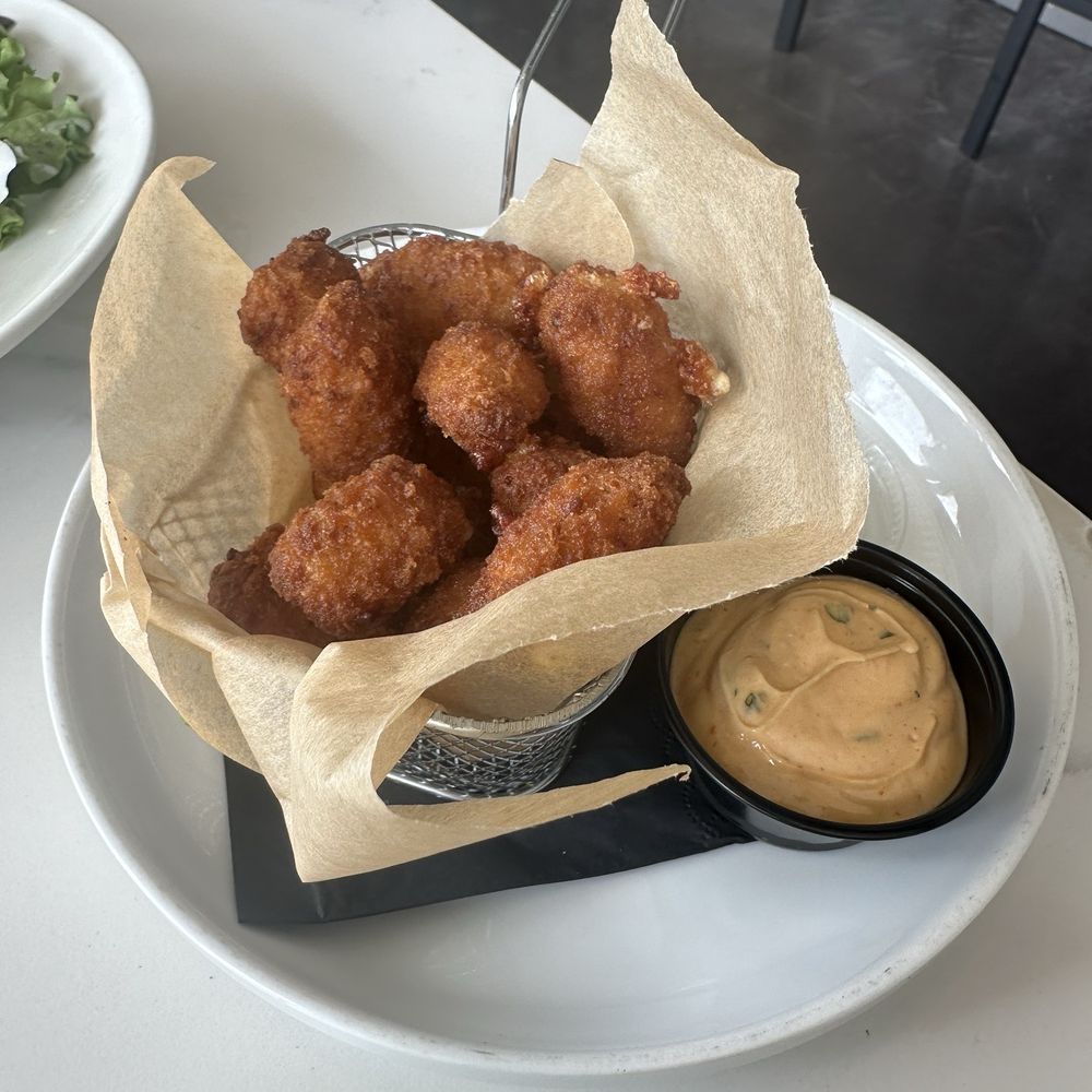 Cape Cabaret - BUFFALO CHEDDAR BITES - Hot & spicy fried Cheddar Curds served with a delicious Lime Aioli - American Near Me - Cape Coral, Florida