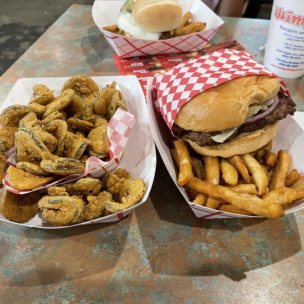 two burgers and onion rings two burgers and onion rings