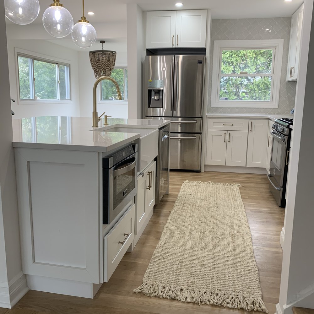 Jav Home Automation - a kitchen with stainless steel appliances - Home Automation Near Me - Queens, New York Jav Home Automation - a kitchen with stainless steel appliances - Home Automation Near Me - Queens, New York
