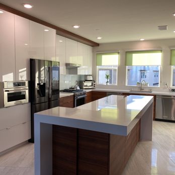Metic Design - a modern kitchen with stainless steel appliances - General Contractors Near Me