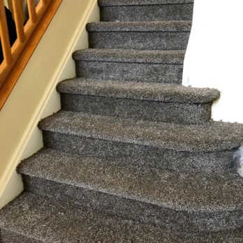 Rojas Carpet and Flooring - a dog sitting on the stairs - Carpet Installation Near Me - Denver, Colorado Rojas Carpet and Flooring - a dog sitting on the stairs - Carpet Installation Near Me - Denver, Colorado