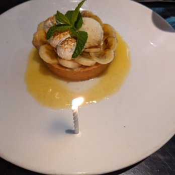 Coyote Cafe - Banana Cream Pie (with a birthday candle) - New American Near Me - Santa Fe, New Mexico