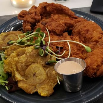 Típico - Pechuga empanada ($18): chicken cutlet with tostones - Puerto Rican Near Me - Guaynabo, Puerto Rico