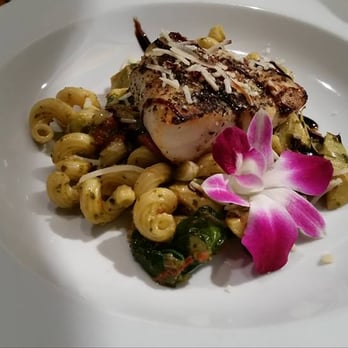 Aqua Restaurant - Grilled grouper over cavatappi pasta with artichoke hearts, tomatoes, spinach, zucchini, a white wine and kale pesto and balsamic glaze. - Seafood Near Me - Beaufort, North Carolina Aqua Restaurant - Grilled grouper over cavatappi pasta with artichoke hearts, tomatoes, spinach, zucchini, a white wine and kale pesto and balsamic glaze. - Seafood Near Me - Beaufort, North Carolina