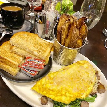 Puyalapabs Cafe - The delicious $8 4-topping omelette, comes w/ potatoes of choice and toast!! - Cafes Near Me - Tacoma, Washington