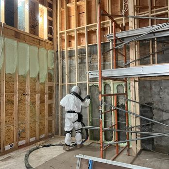 Royal Insulation - a man in a protective suit working on a building - General Contractors Near Me - Toronto, Ontario Royal Insulation - a man in a protective suit working on a building - General Contractors Near Me - Toronto, Ontario
