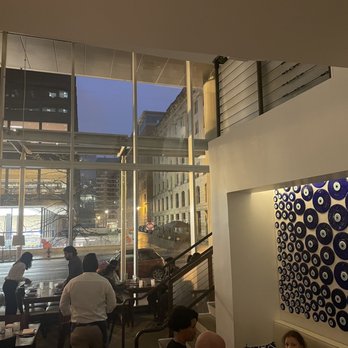 Zaytinya - Dining room and stairs to overlook seating area - Greek Near Me - Washington, DC, District of Columbia Zaytinya - Dining room and stairs to overlook seating area - Greek Near Me - Washington, DC, District of Columbia