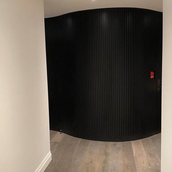 Bisceglia Contracting - a curved wall in a hallway - General Contractors Near Me