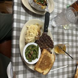 The Hooting Chicken - Ribeye, loaded baked potato, green beans, toast and a Templeton Rye Whiskey.