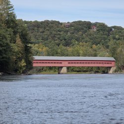 Parc Hendrick - A view of the Wakefield Covered Bridge and Parc Hendrick from a canoe in the middle of the river.