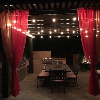 Brothers Construction - a patio with a table and chairs - General Contractors Near Me - Woodland Hills, California Brothers Construction - a patio with a table and chairs - General Contractors Near Me - Woodland Hills, California