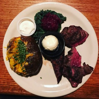 Bynum's Steakhouse - Beef tips lunch special with a side of baked potato and the obligatory cranberry relish. - Steakhouses Near Me - Indianapolis, Indiana