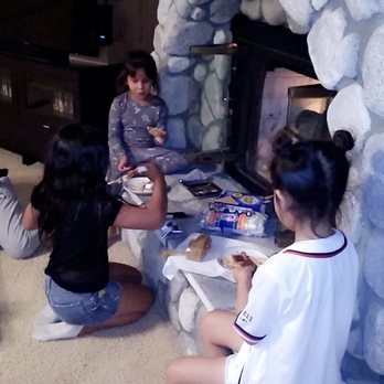 Big Bear Vacations - Kids enjoying the beautiful fireplace, making delicious s'mores - Vacation Rentals Near Me - Big Bear Lake, California Big Bear Vacations - Kids enjoying the beautiful fireplace, making delicious s'mores - Vacation Rentals Near Me - Big Bear Lake, California