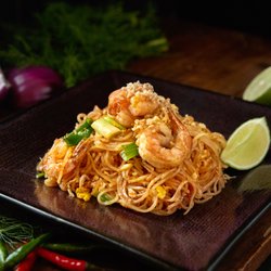 Am Thai Bistro - Pad Thai (GF)  The most famous thai noodle dish, stir fried noodle, bean sprout, scallion crunched peanut and egg in pad thai sauce.