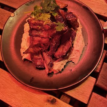 Shukette - Crispy fairytale eggplant with labne, coriander hot honey, and cilantro - Middle Eastern Near Me - New York, New York