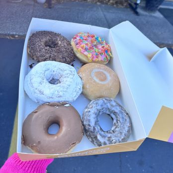 Swiches - a person holding a box of doughnuts - Donuts Near Me - Berlin, Connecticut Swiches - a person holding a box of doughnuts - Donuts Near Me - Berlin, Connecticut