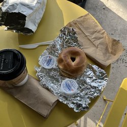 WILLY Cafe And Market - A over the counter frozen bagel and a cup of coffee and cream cheese