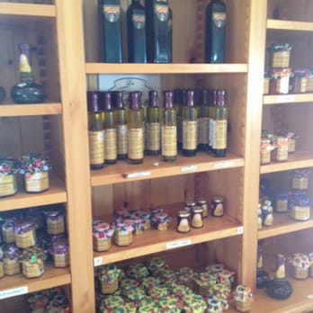 Laiterie Charlevoix - a shelf full of wine bottles - Cheese Shops Near Me - Baie-Saint-Paul, Quebec